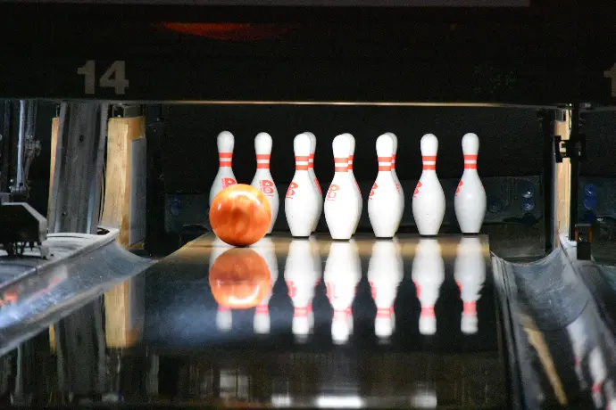 bowling ball going to hit bowling pins